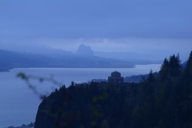 Scenic view of mountains against sky at dusk