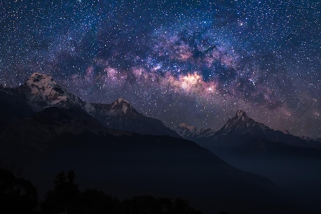 scenic view of mountains against sky at night