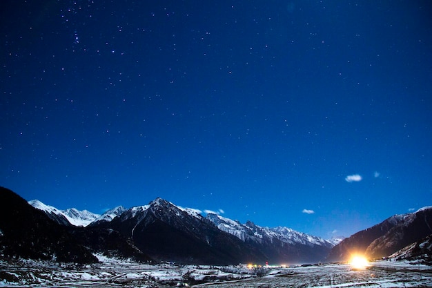 scenic view of mountains against sky at night