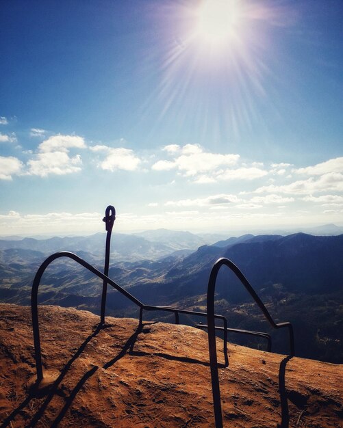 Scenic view of mountains against sky on sunny day