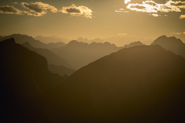 Scenic view of mountains against sky at sunset