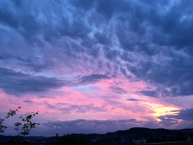 Scenic view of mountains against sky at sunset