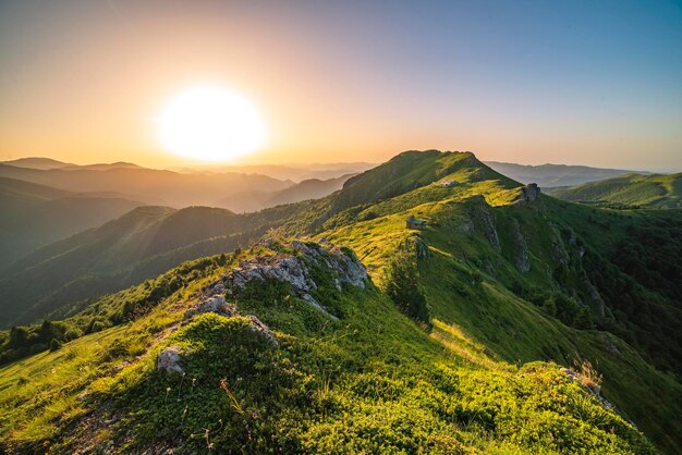 Scenic view of mountains against sky during sunset