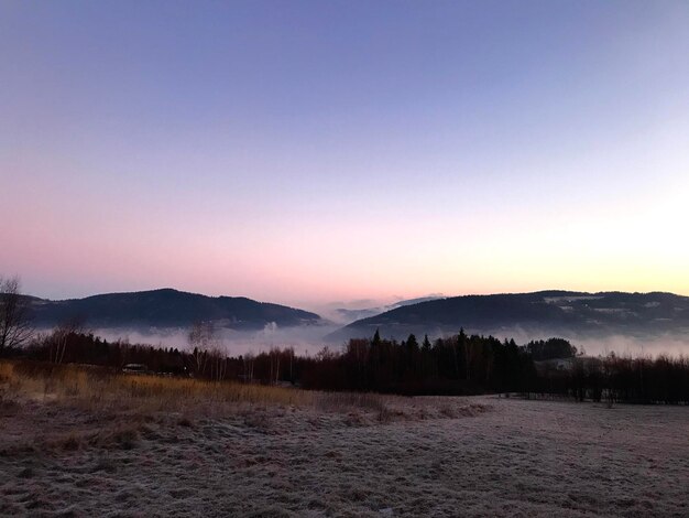 Scenic view of mountains against sky during sunset