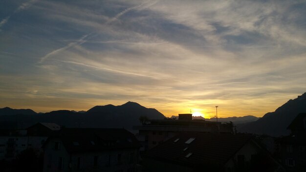 Scenic view of mountains against sky at sunset