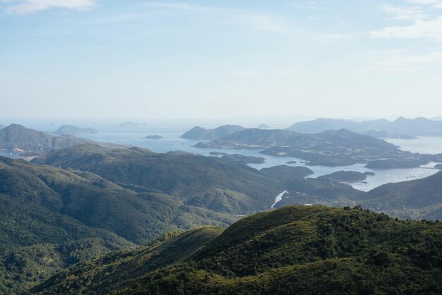 Scenic view of mountains by sea against sky