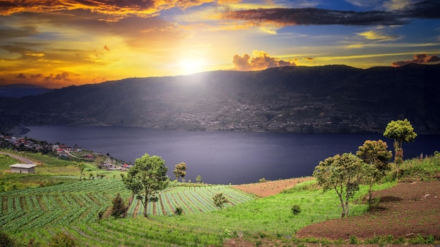 Scenic view of the mountains and lake in sunset