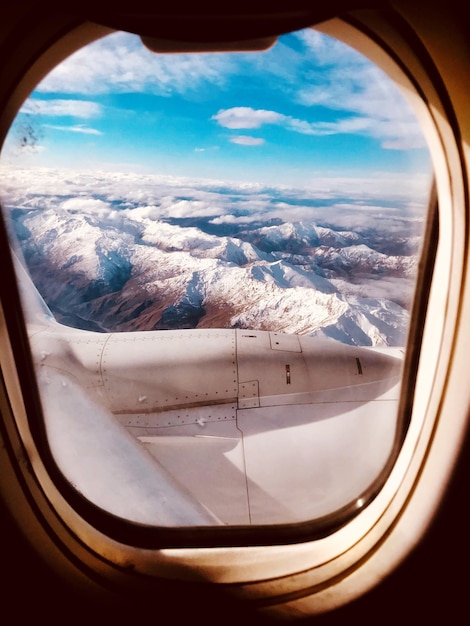 scenic view of mountains seen through airplane window