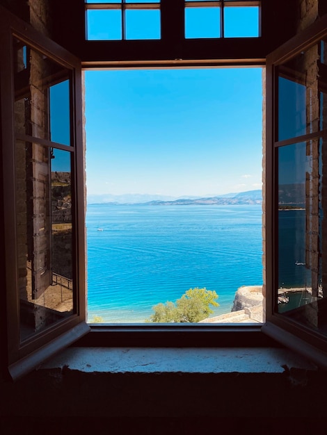 Scenic view of mountains seen through window