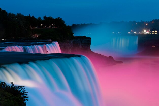 Photo scenic view of river against clear sky at night