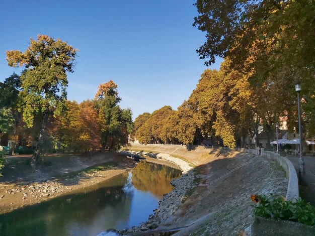 Scenic view of river against sky during autumn