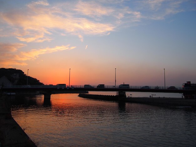 Photo scenic view of river against sky during sunset