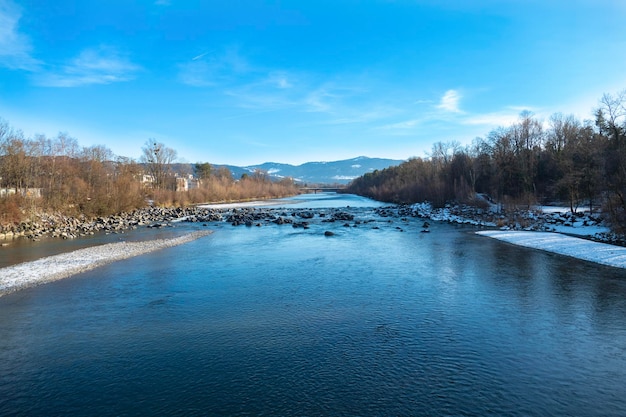 Scenic view of river against sky during winter