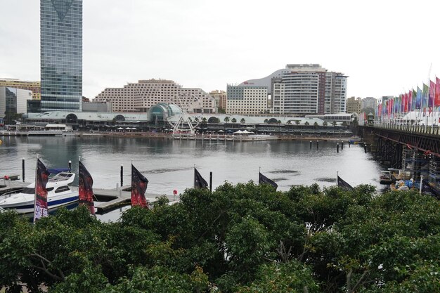 Scenic view of river by buildings against sky