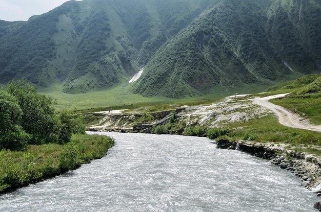 Scenic view of road amidst mountains