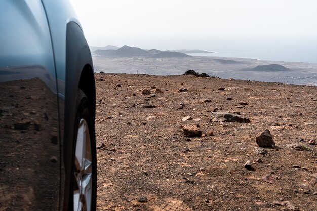 Scenic view of road by mountains against sky