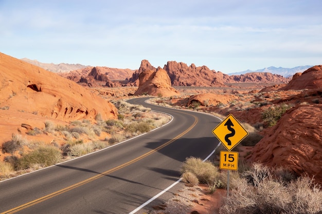 Scenic view on the road in the desert during a cloudy sunrise