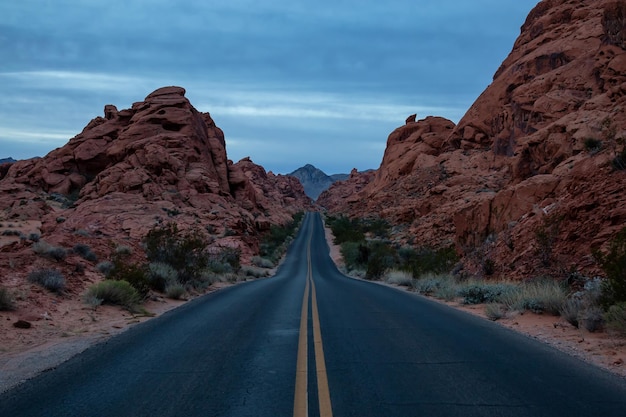 Scenic view on the road in the desert during a cloudy sunrise