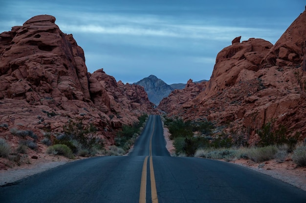 Scenic view on the road in the desert during a cloudy sunrise