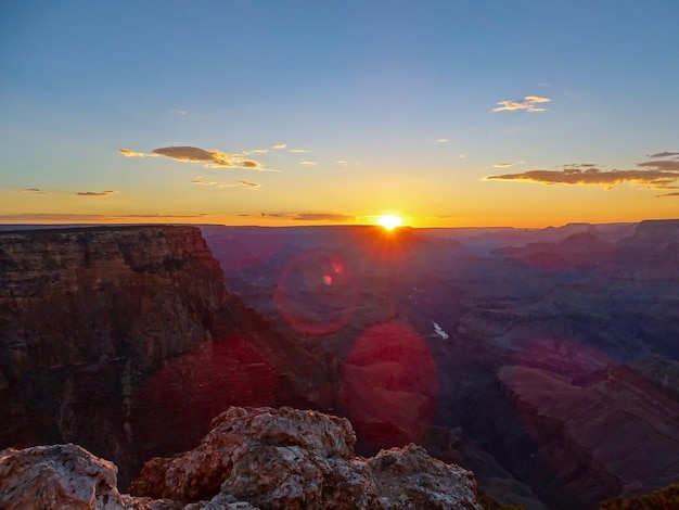 Photo scenic view of rock formation against sky during sunset