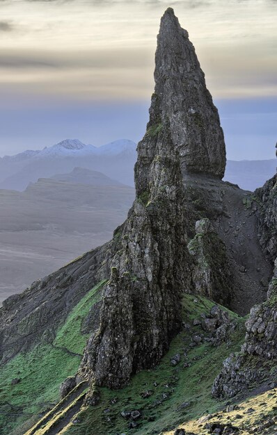 Scenic view of rock formation in sea against sky