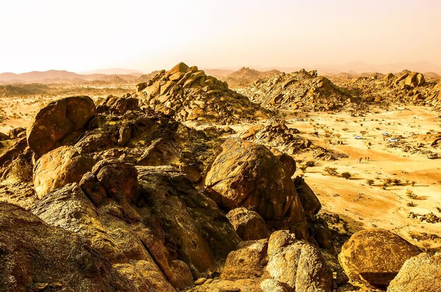 Photo scenic view of rock formations against sky