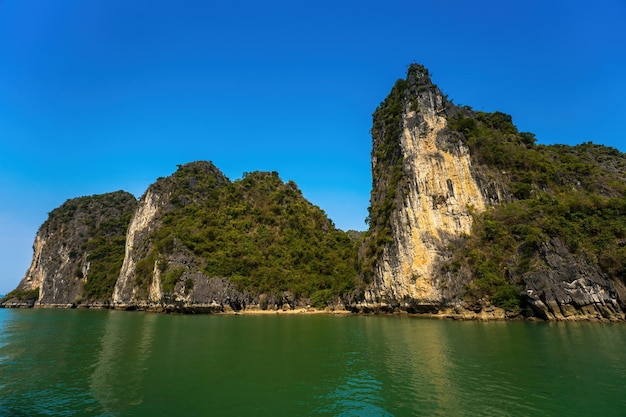 Scenic view of rock island in halong bay vietnam southeast asia unesco world heritage site mountain islands at ha long bay beautiful landscape popular asian landmark famous destination of vietnam