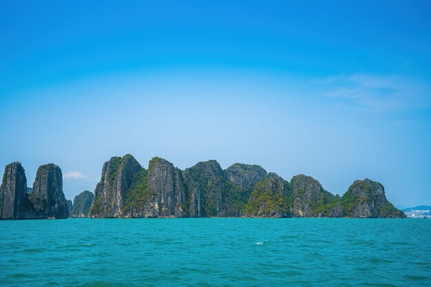 Scenic view of rock island in halong bay vietnam southeast asia unesco world heritage site mountain islands at ha long bay beautiful landscape popular asian landmark famous destination of vietnam