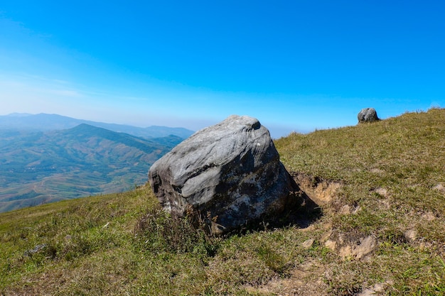 Scenic view of rocky mountains against blue sky