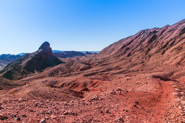 Scenic view of rocky mountains against clear blue sky