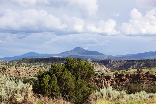 scenic view of rocky mountains against cloudy sky