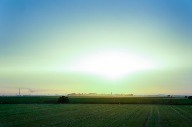 Photo scenic view of rural landscape against sky during sunset