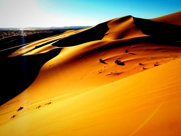 Scenic view of sahara desert against clear sky