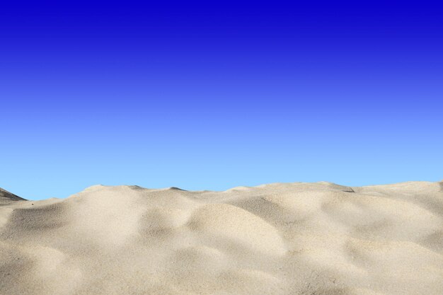 Scenic view of sand dunes against clear blue sky