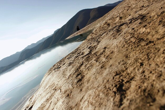 Photo scenic view of sand dunes against sky