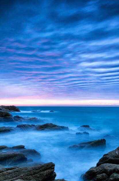 Scenic view of sea against blue sky