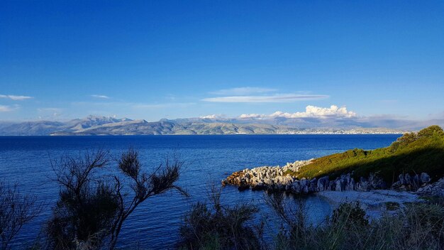 Scenic view of sea against blue sky