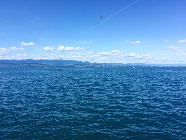 Scenic view of sea against blue sky