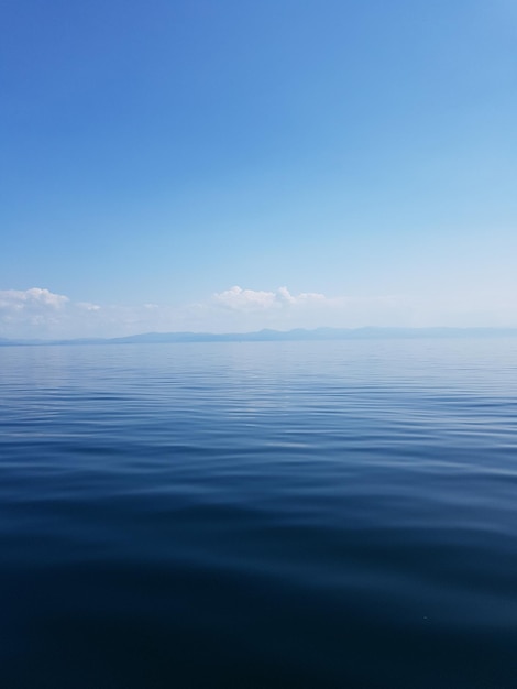 Photo scenic view of sea against blue sky