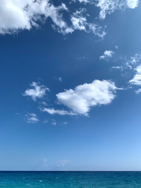 Scenic view of sea against blue sky