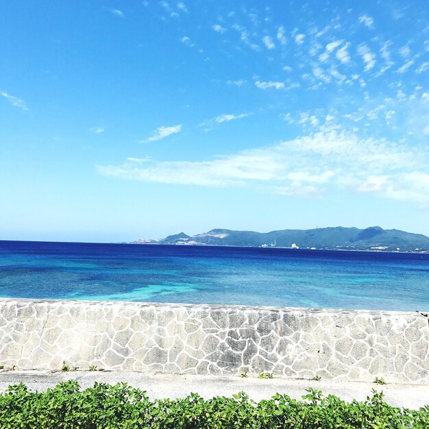 Scenic view of sea against blue sky