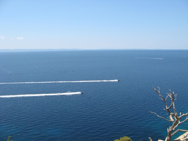 Scenic view of sea against blue sky