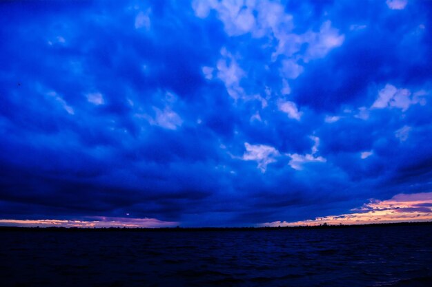 Scenic view of sea against blue sky