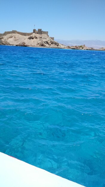 Scenic view of sea against blue sky