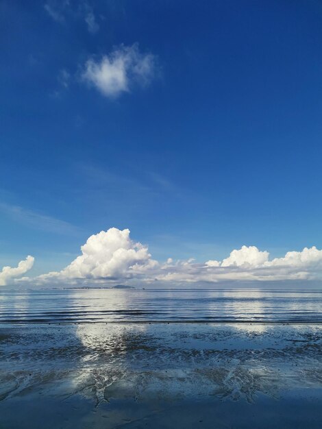 Scenic view of sea against blue sky