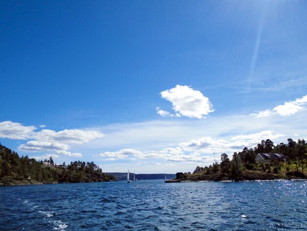 Scenic view of sea against blue sky