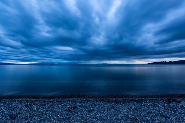 Scenic view of sea against blue sky