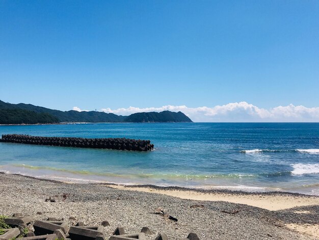 Scenic view of sea against blue sky