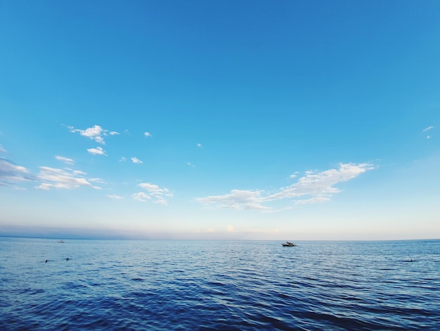 Scenic view of sea against blue sky