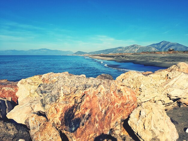 Scenic view of sea against blue sky